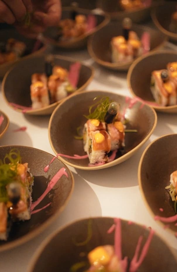 Torched salmon rolls in handmade bowls