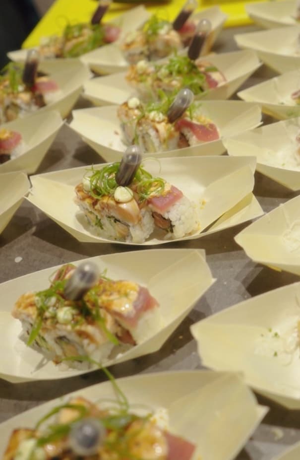 Sushi in wooden boats, ready to be served